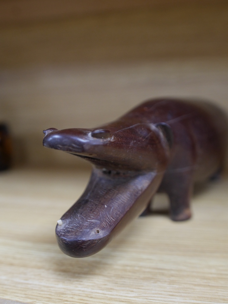 An African carved hardwood model of a hippopotamus, 45cm wide. Condition - poor to fair